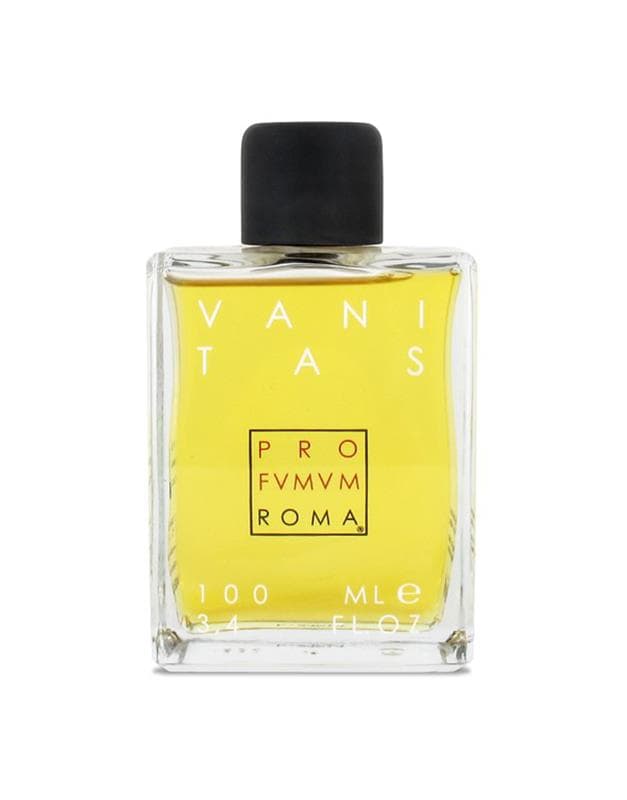 Vanitas perfume bottle with yellow liquid, black cap, and white label