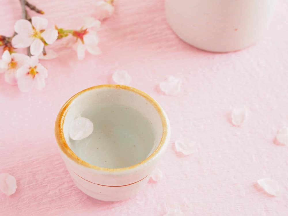 Hanamizake: Traditional Japanese sake served in a ceramic cup with cherry blossoms
