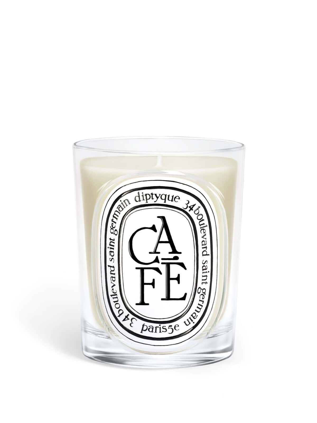 Diptyque Café Classic Candle: A white candle in a clear glass jar with an oval label featuring the word "CAFÉ