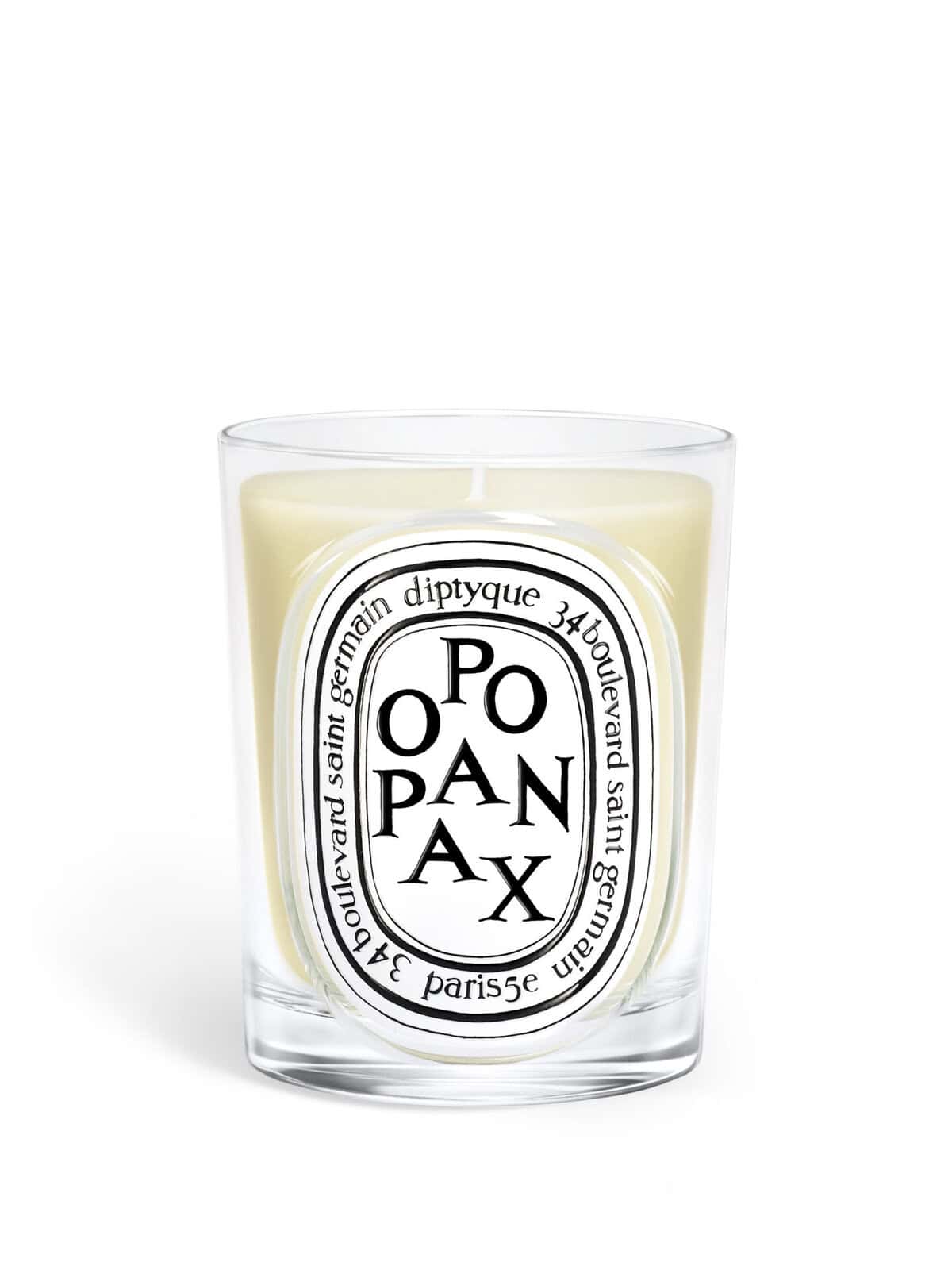 Diptyque Opax candle in a clear glass jar with oval label featuring black text