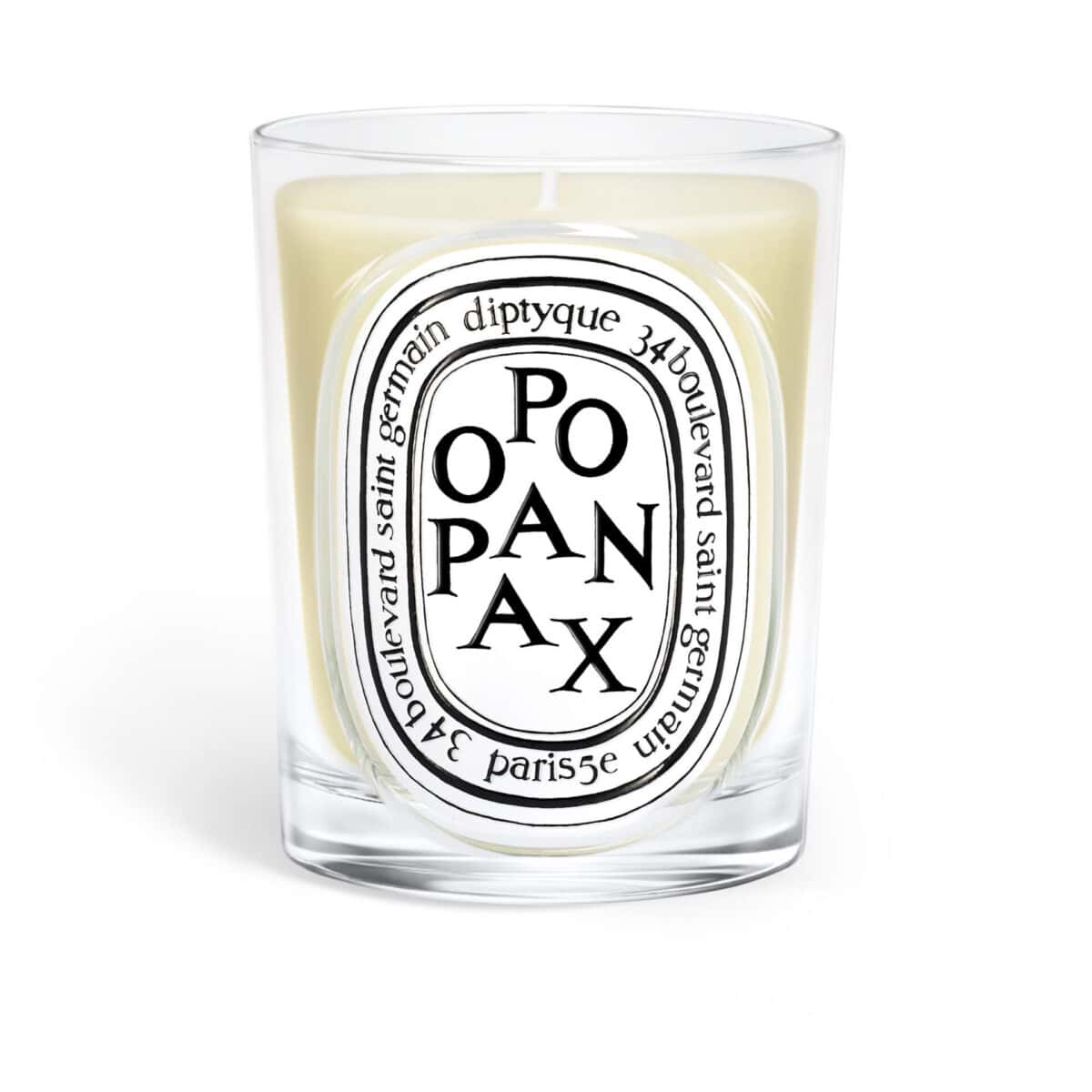 Diptyque Opax candle in a clear glass jar with oval label featuring black text