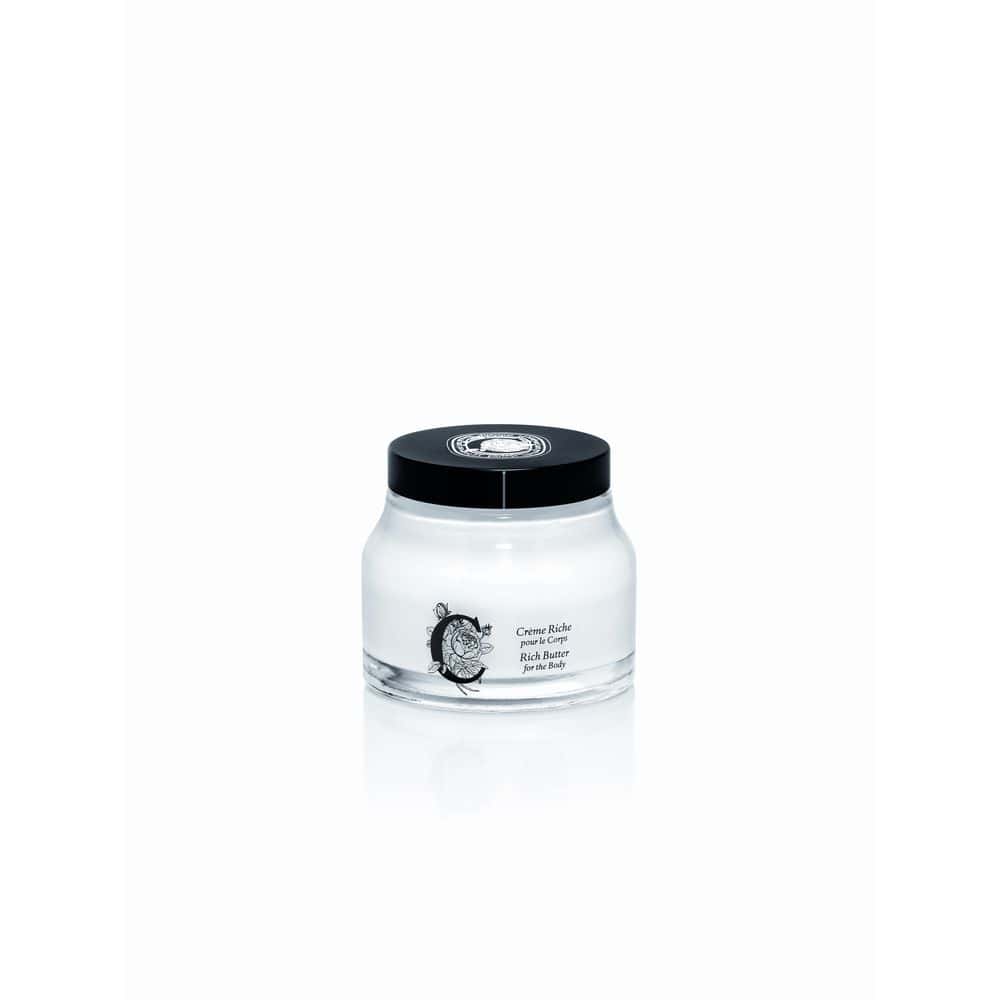 Rich Butter for the Body: Glass jar with black lid, creamy white lotion inside, elegant floral label