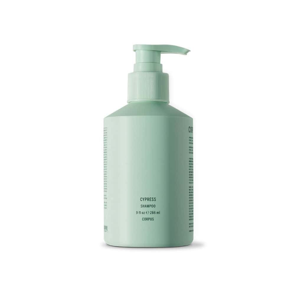 Corpus Cypress Shampoo: A light green pump bottle of cypress scented shampoo for hair care.