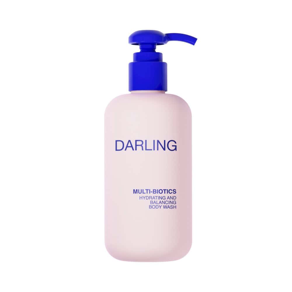 Darling Multi-Biotics Hydrating and Balancing Body Wash in a light pink bottle with a blue pump