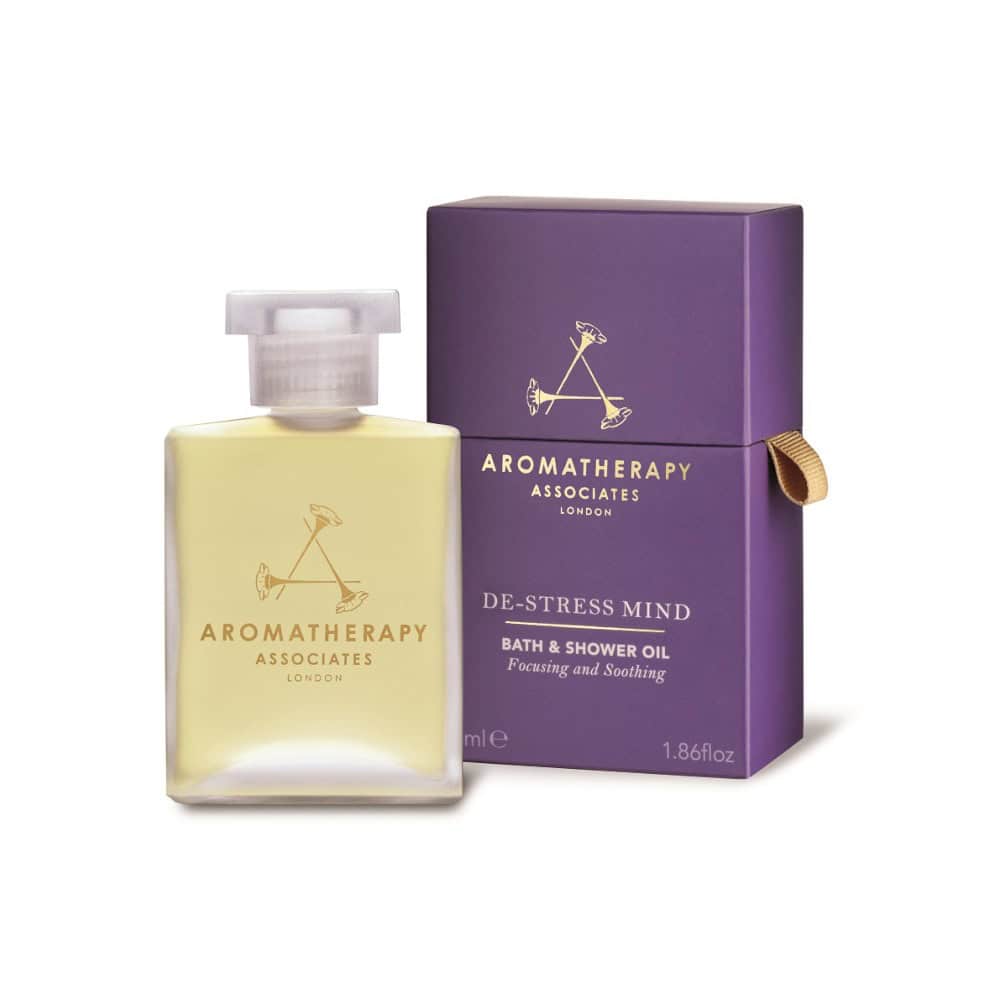 Aromatherapy Associates De-Stress Mind Bath & Shower Oil bottle in clear glass with a purple box featuring brand logo
