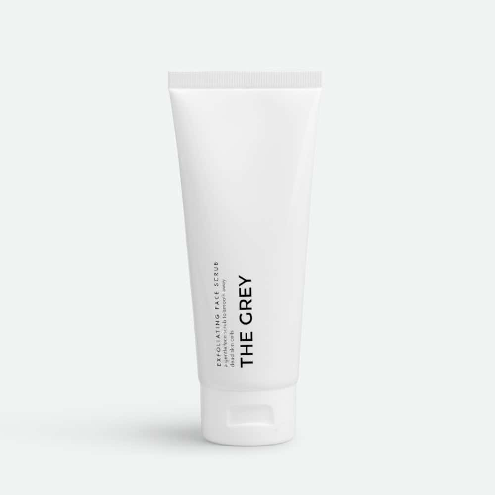The Grey Exfoliating Face Scrub: White tube with black text for gentle facial exfoliation