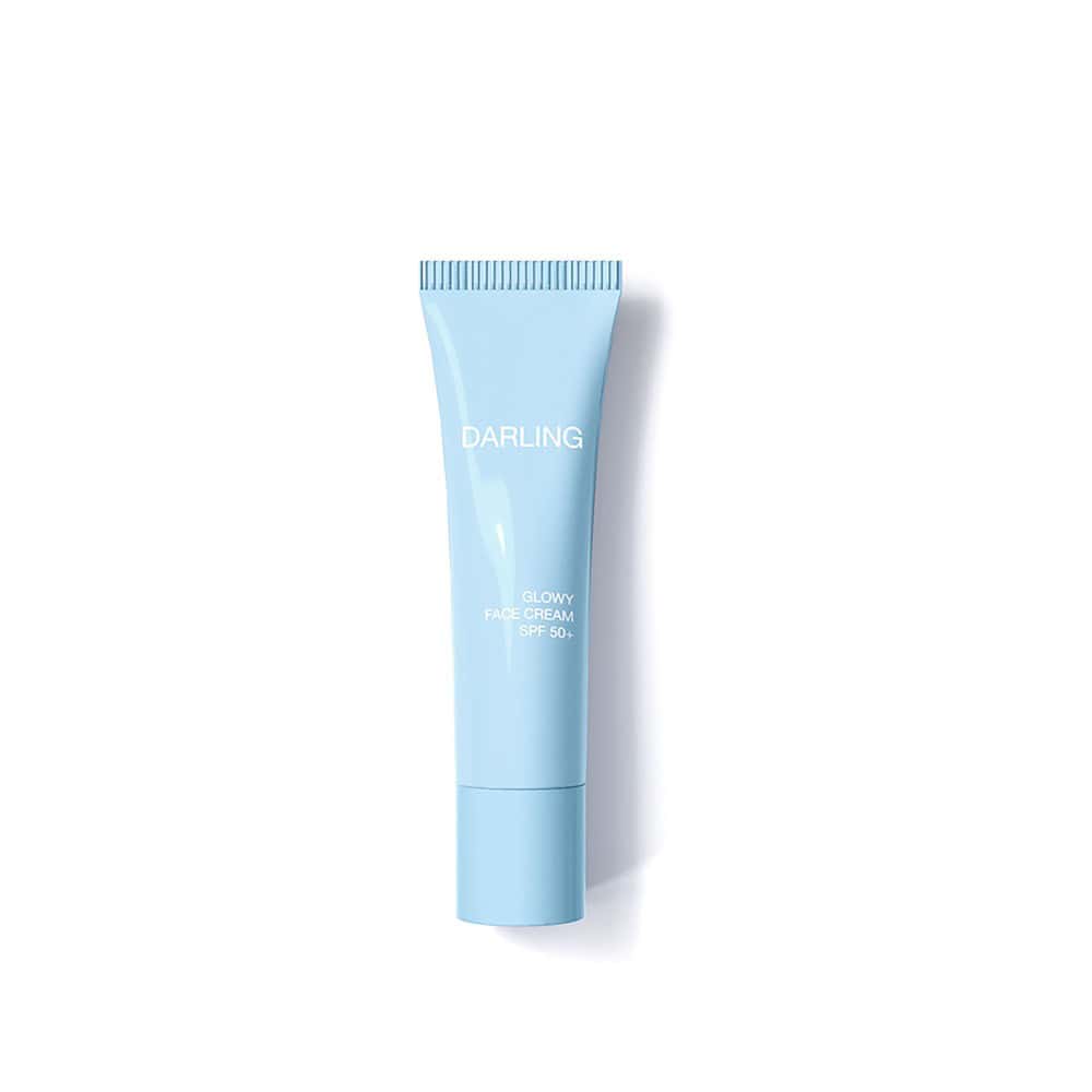 Darling Glowy Face Cream SPF50+ in a light blue squeeze tube