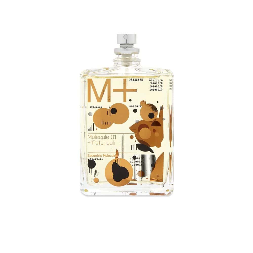 Molecule 01 + Patchouli Eau de Toilette by Escentric Molecules in a clear glass bottle with abstract gold and black design.