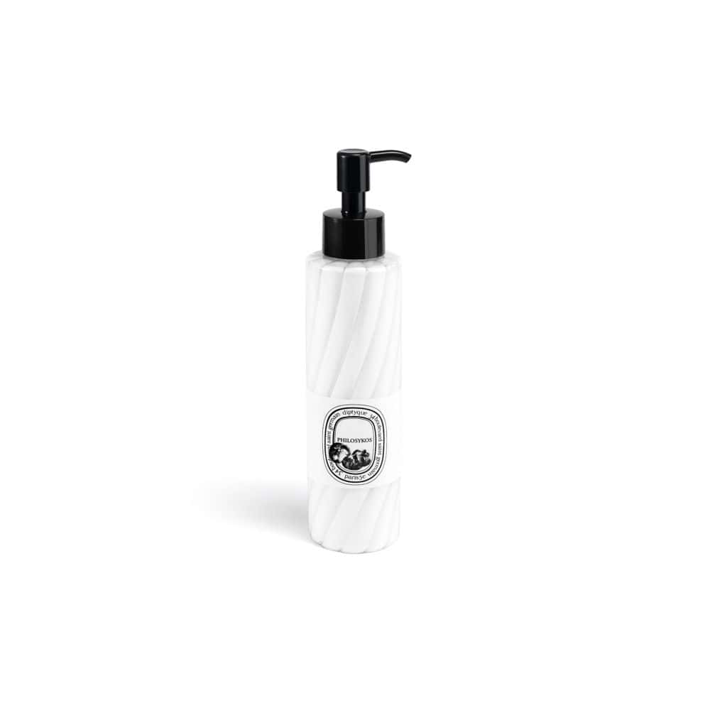 Philosykos Body Lotion in white bottle with black pump dispenser and swirl pattern, perfect for moisturizing skin