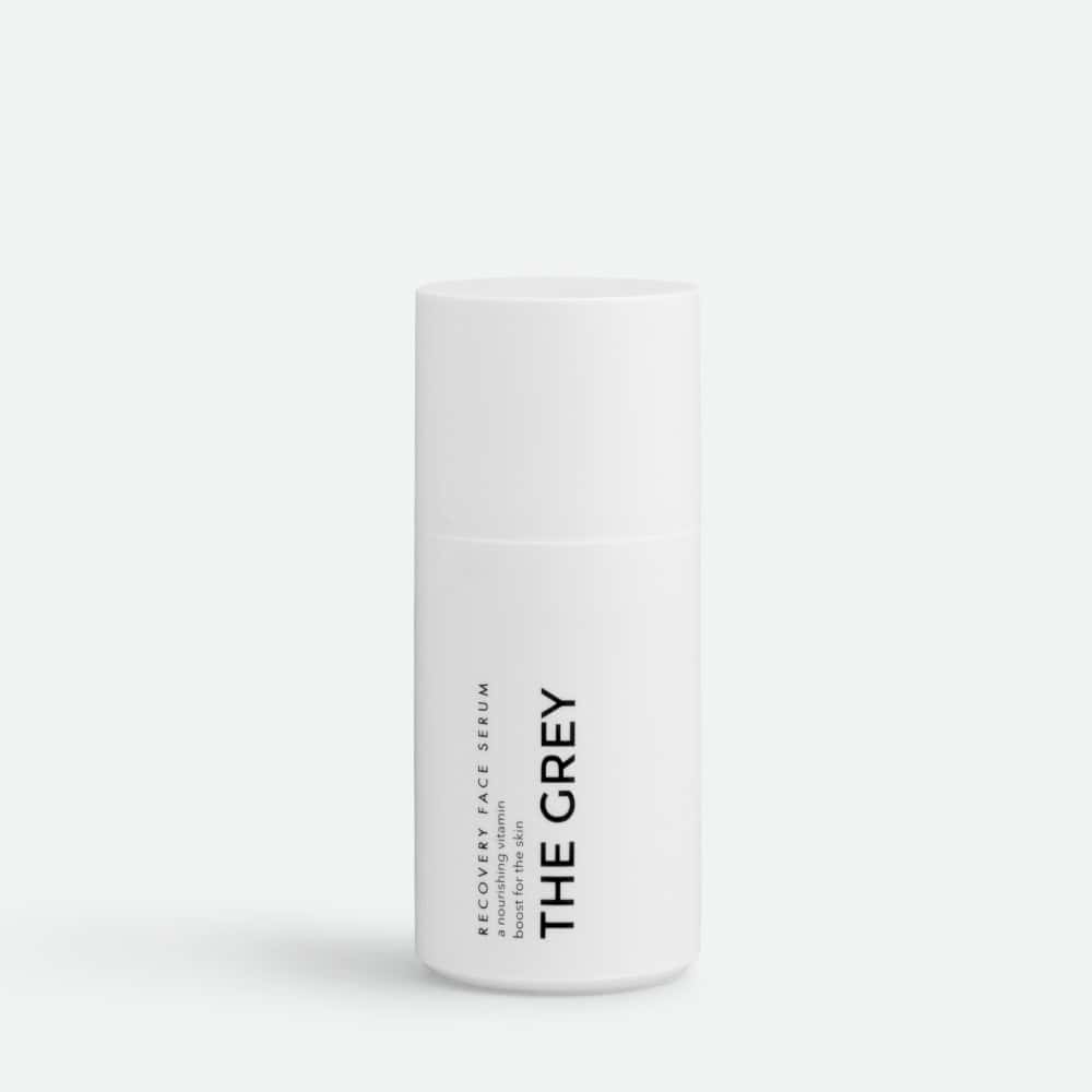 The Grey Recovery Face Serum bottle with white minimalist design