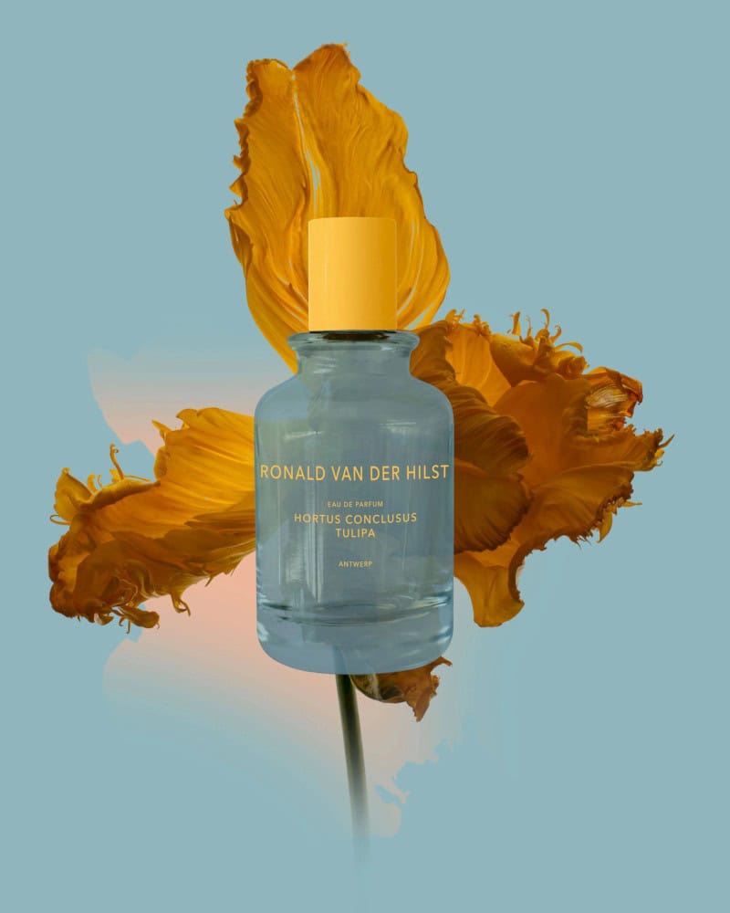 Ronald van der Hilst Hortus Conclusus Tulipa Eau de Parfum bottle with yellow cap, surrounded by a yellow tulip.