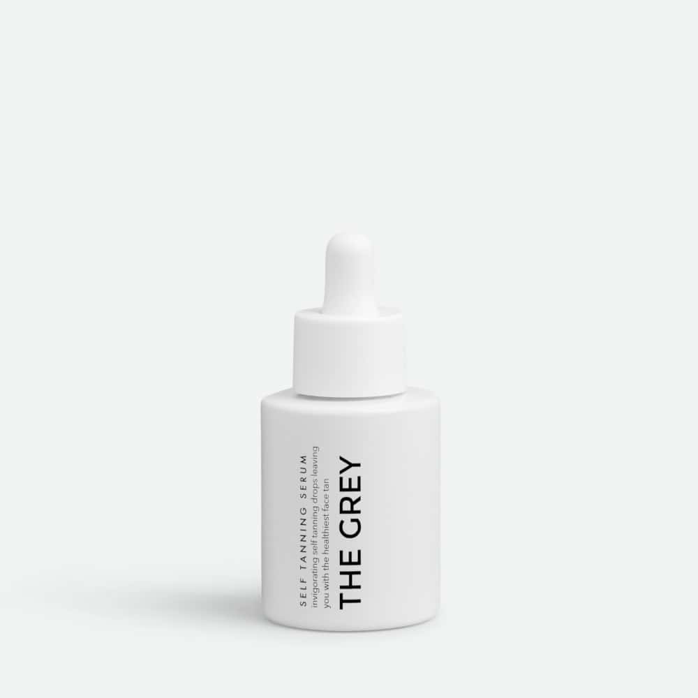The Grey Self Tanning Serum bottle with dropper