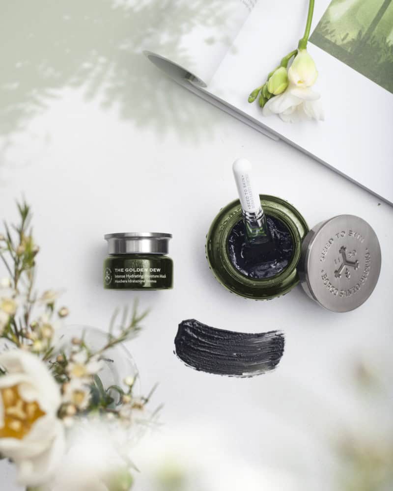 The Golden Dew mask jar with applicator and swatch
