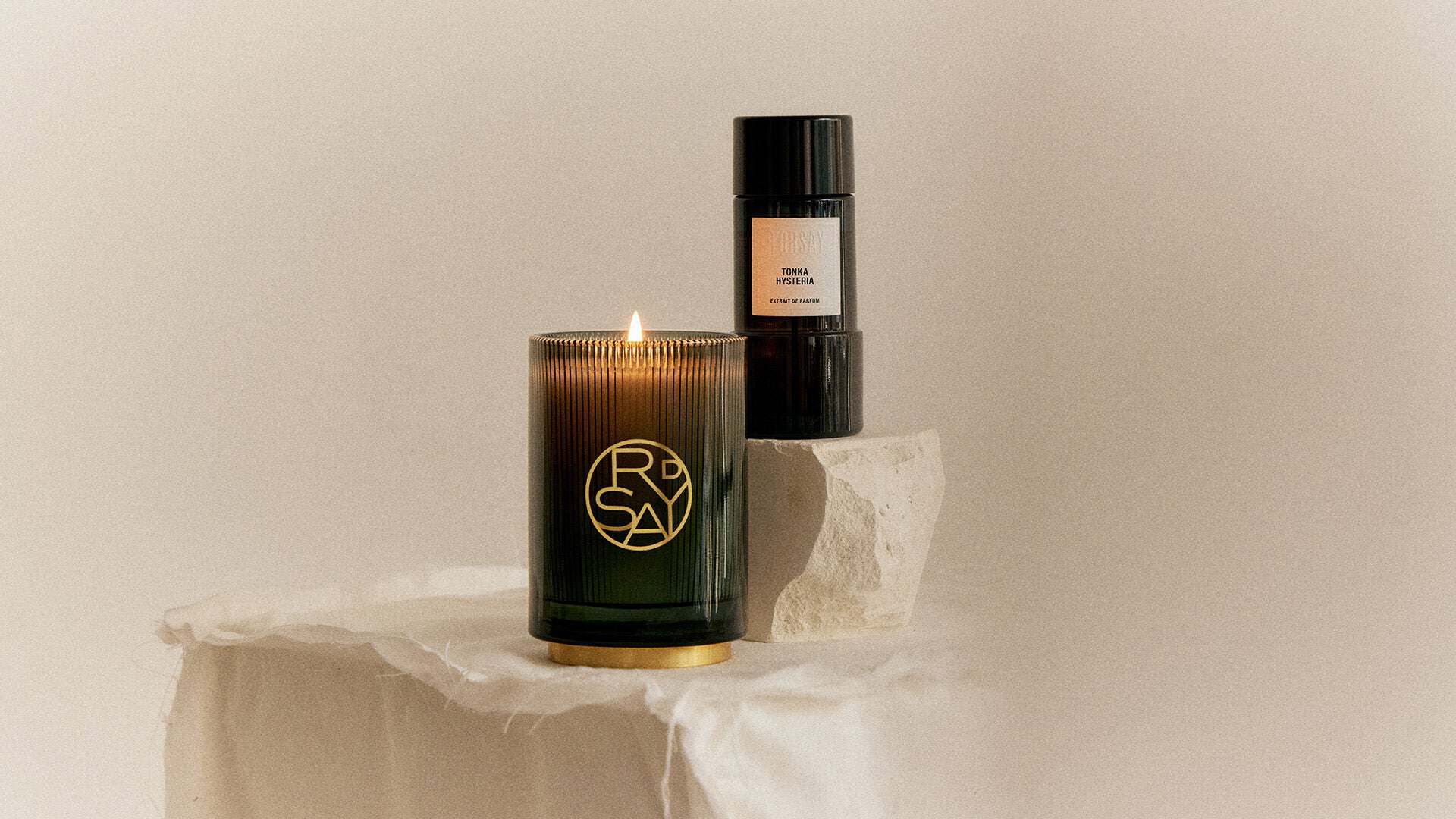 ROSAY candle and TINKA HYSTERIA perfume bottle