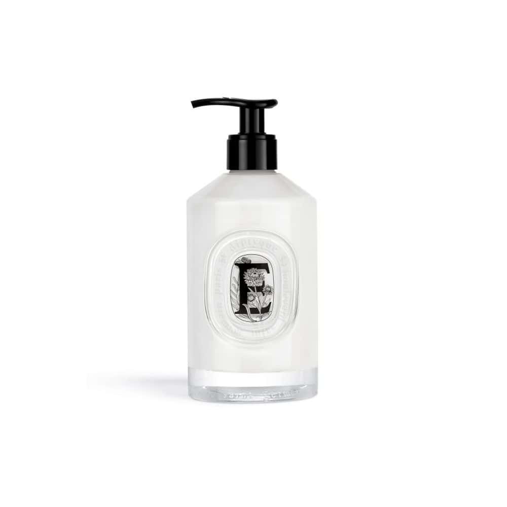 Diptyque Velvet Hand Lotion in a clear glass bottle with a black pump dispenser and oval label