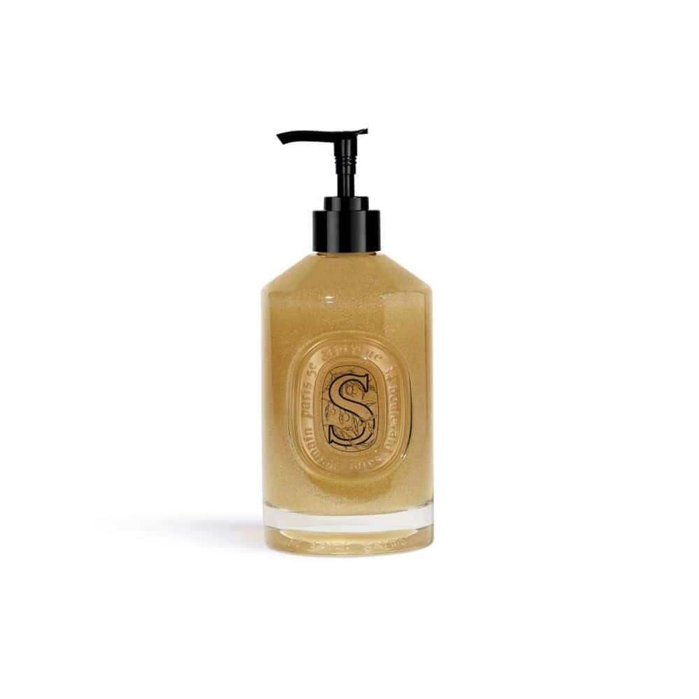 Diptyque Exfoliating Hand Wash in a clear glass bottle with black pump dispenser